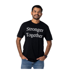 MD Anderson employee wearing a black shirt featuring the white "Stronger Together" phrase.