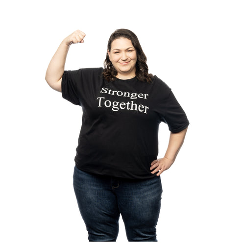 MD Anderson employee wearing a black shirt featuring the words 