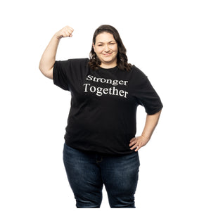 MD Anderson employee wearing a black shirt featuring the words "Stronger Together" in white text.