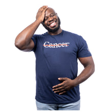 MD Anderson employee wearing a navy blue shirt featuring the white cancer strikethrough logo on the chest and the white MD Anderson logo on the sleeve.