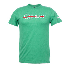 Irish green shirt featuring the white cancer strikethrough logo on the chest and the white UT MD Anderson logo on the sleeve.