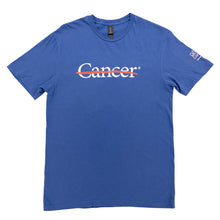 Blue shirt featuring the white cancer strikethrough logo on the chest and the white MD Anderson logo on the sleeve.