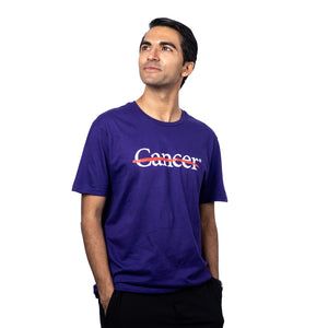 MD Anderson employee wearing a purple shirt featuring the white cancer strikethrough logo on the chest and the white MD Anderson logo on the sleeve.