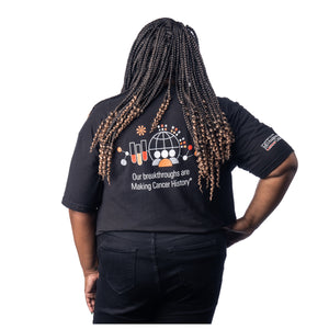 MD Anderson employee wearing the back of black t-shirt with research logo featuring the text "Our breakthroughs are Making Cancer History".