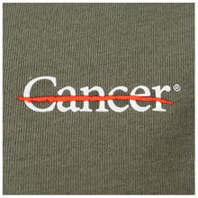 Close-up of white cancer strikethrough logo on the chest area.