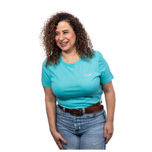 MD Anderson employee wearing a teal BELLA+CANVAS shirt featuring the white cancer strikethrough logo on the left upper chest area.