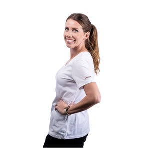 MD Anderson employee wearing a white BELLA+CANVAS v-neck shirt featuring the black cancer strikethrough logo on the sleeve.