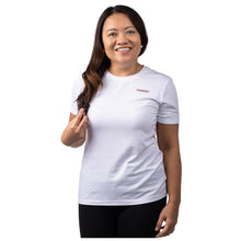 MD Anderson employee wearing a white shirt with black cancer strikethrough logo on the chest area.