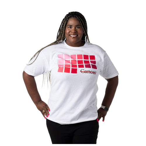 MD Anderson employee wearing a white shirt with a grid of pink colors blending from light to dark tones of pink featuring the black cancer strikethrough logo.