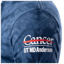 Closeup up of the white UT MD Anderson logo.