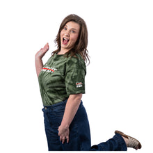 MD Anderson employee wearing a green tie-dye short-sleeve t-shirt with the white Cancer strikethrough logo across the chest and the UT MD Anderson logo on the sleeve.
