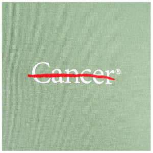 Closeup of white cancer strikethrough logo.