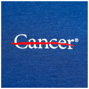 Closeup of white cancer strikethrough logo.