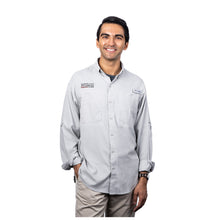 MD Anderson employee wearing a Columbia button up shirt featuring the black MD Anderson logo on the upper right chest area and the Columbia logo on the upper left chest area with front chest pockets.