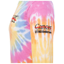 Side view of Multicolor long sleeve tie-dye shirt featuring the black cancer strikethrough logo on the chest and the black UT MD Anderson logo on the sleeve.