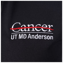 Closeup of the white UT MD Anderson logo.