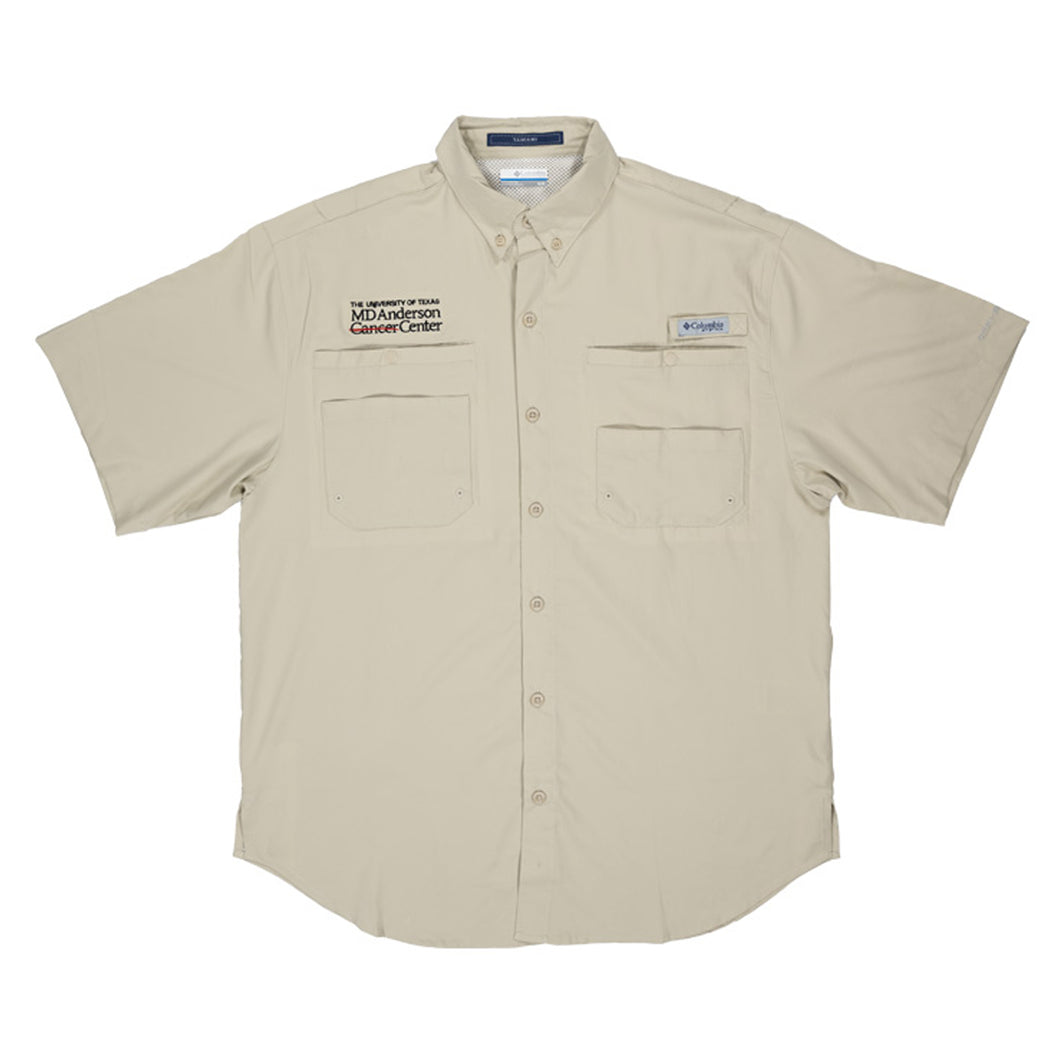 Short sleeve tan Columbia button-up shirt with two chest pockets, featuring the black MD Anderson logo on one side and the Columbia logo on the other side.