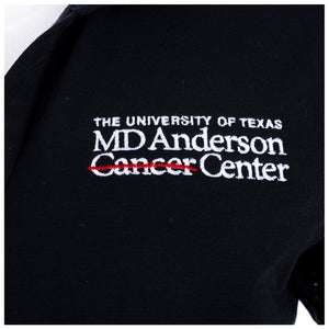 Close-up of the full white MD Anderson logo on the chest area.