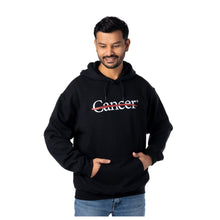 MD Anderson employee wearing a black hooded sweatshirt with the cancer strikethrough logo in white.