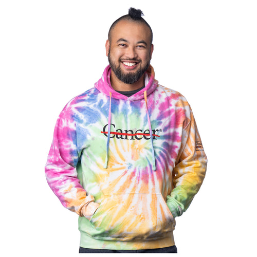 MD Anderson employee wearing a tie-dye sweatshirt featuring the black cancer strikethrough logo on the chest area and the black MD Anderson logo on the sleeve.