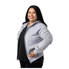 MD Anderson employee wearing a gray BELLA+CANVAS zip-up fleece hoodie with no pockets featuring the black cancer strikethrough logo on the sleeve hem.