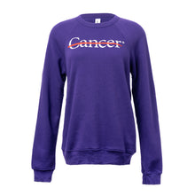 Purple crewneck featuring the white cancer strikethrough logo in the middle.