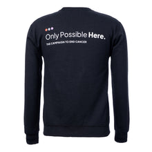 Back of black crewneck featuring the white tagline "Only Possible Here, the campaign to end cancer."