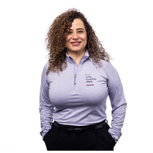 MD Anderson employee wearing a lavender 1/4 zip sweater featuring the tagline "Only Possible Here" and the black cancer strikethrough logo on the top left chest area.