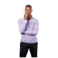 MD Anderson employee wearing a lilac long-sleeve 1/4 zip pullover featuring the "Only Possible Here" tagline and the black Cancer strikethrough logo on the left chest.