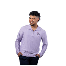 MD Anderson employee wearing a lilac long-sleeve 1/4 zip pullover featuring the "Only Possible Here" tagline and the black Cancer strikethrough logo on the left chest.