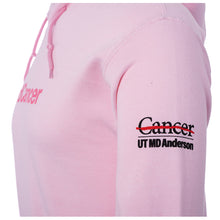 Side view of hooded Sweatshirt in light pink featuring the #EndCancer logo printed on the chest and the full black UT MD Anderson logo on the sleeve.
