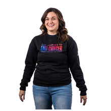 MD Anderson employee wearing a black crewneck featuring the tagline "The Journey to End Cancer - From Cause to Cure" in a multicolor gradient.