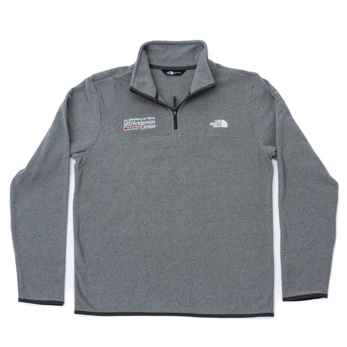 Gray North Face fleece jacket featuring the white MD Anderson logo on the right side of the chest and the white North Face logo on the left side of the chest, featuring a quarter-zip.