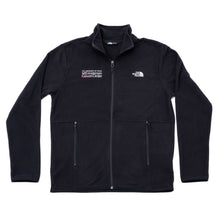 Black North Face fleece jacket featuring a full zipper, stand-up collar, and zippered pockets, with a full white UT MD Anderson logo on the right chest and the white North Face logo on the left chest.