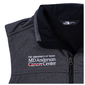 Closeup of gray North Face fleece vest featuring the white MD Anderson logo on the right side of the chest.