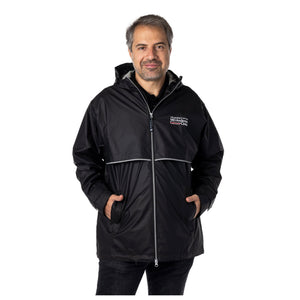 MD Anderson employee wearing a black rain jacket with front pockets featuring the full white MD Anderson logo on the left upper chest area.