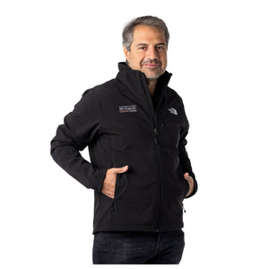 MD Anderson employee wearing a black North Face zip-up jacket with zippered pockets in the front featuring the full white MD Anderson logo on the top right chest area and the white North Face logo on the top left chest area.