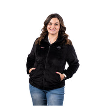 MD Anderson employee wearing a black North Face fleece jacket featuring the white Cancer strikethrough logo on the right chest and a gray North Face logo on the left chest.
