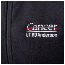 Closeup of the white UT MD Anderson logo.
