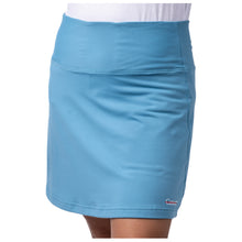 Lagoon blue skort featuring the white cancer strikethrough logo on the bottom seam.