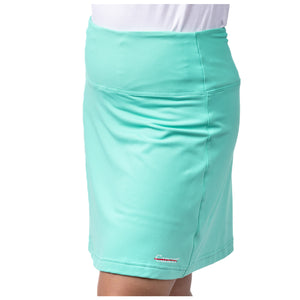 Turquoise skort featuring the white cancer strikethrough logo on the bottom seam.