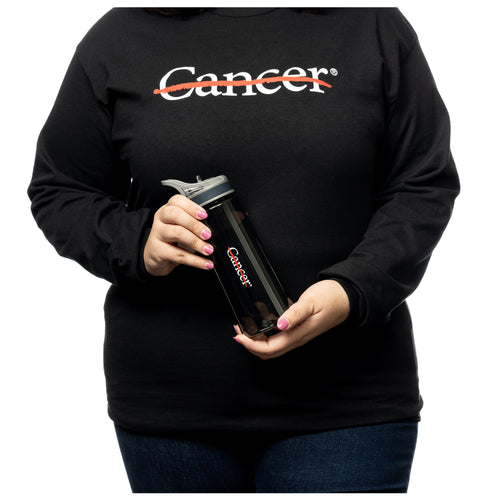 MD Anderson employee holding a gray sport water bottle with a plastic lid featuring the white cancer strikethrough logo, while also wearing a black shirt with the same logo on it.