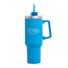 Turquoise 40 oz. travel mug with a straw and  handle, featuring the white MD Anderson logo on the front.