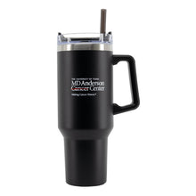 Black 40 oz. travel mug with a straw and handle, featuring the MD Anderson logo on the front.