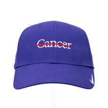 Purple Nike cap with the white cancer strikethrough logo featured in the center, and the Nike swoosh on the front left side.