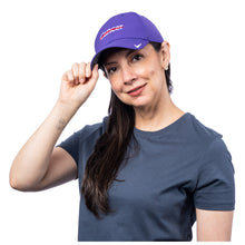 MD Anderson employee wearing a purple Nike cap with the white cancer strikethrough logo featured in the center, and the Nike swoosh on the front left side.