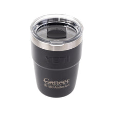 Black YETI 16 oz Rambler Tumbler featuring the full UT MD Anderson logo etched on the front and a clear lid.