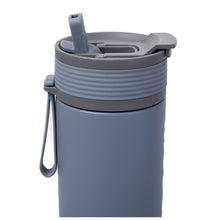 Lid of white ASOBU tumbler with flip-up straw.