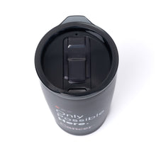 Top view of black tumbler with plastic lid featuring the tagline "Only Possible Here" with the white cancer strikethrough logo, and the plastic top.