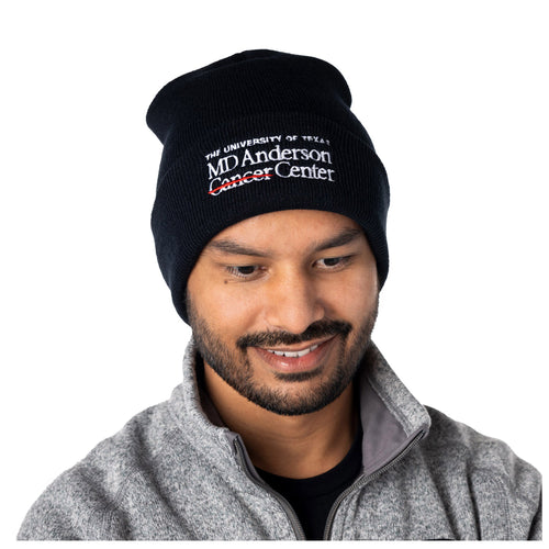 MD Anderson employee wearing a black beanie with white MD Anderson logo.